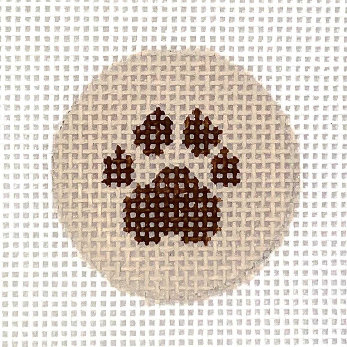 1.25" Round Insert Paw Print brown on tan